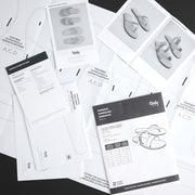 Set of Tandy leathercraft pattern books on a black background