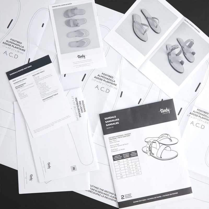 Set of Tandy leathercraft pattern books on a black background