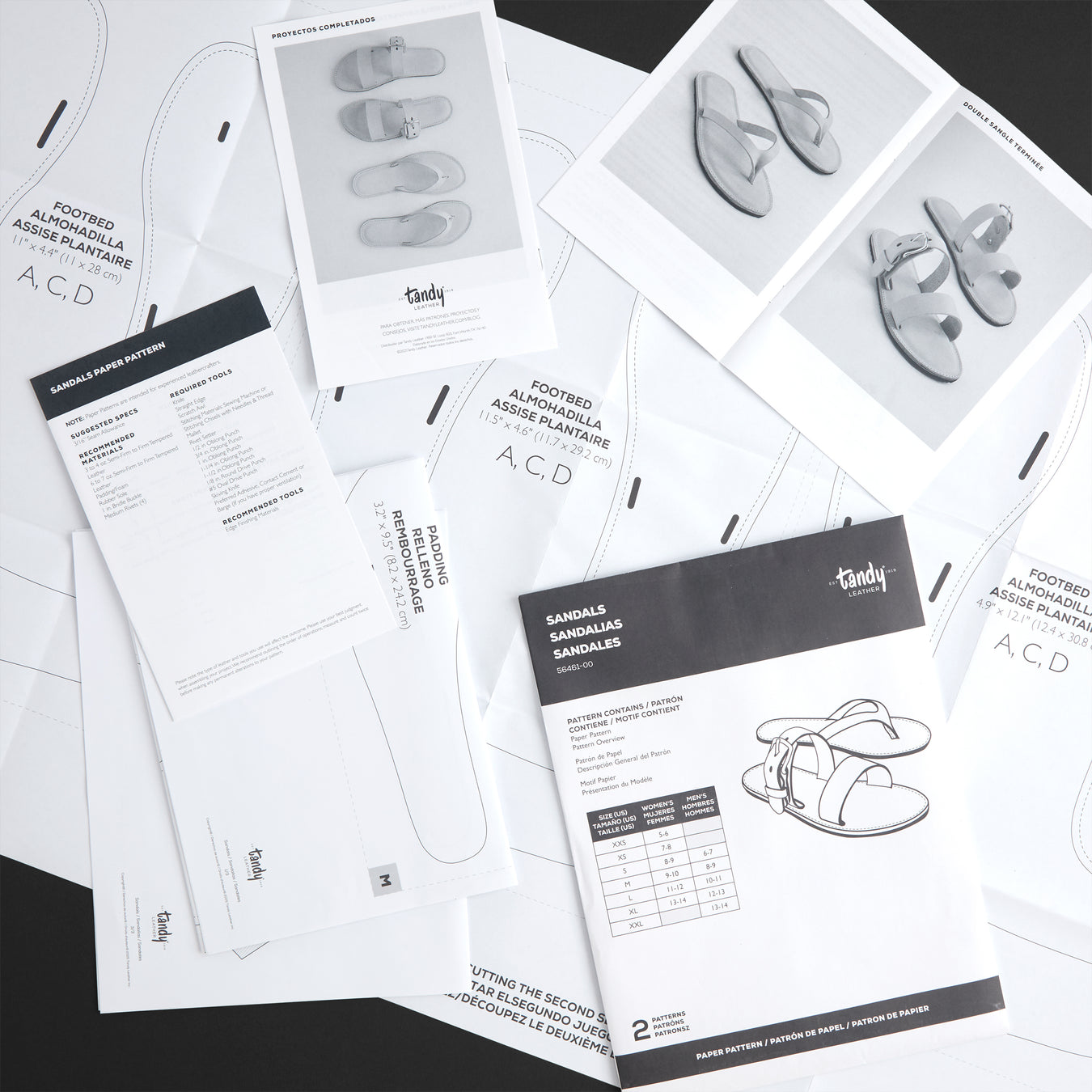 Set of Tandy leathercraft pattern books on a black background