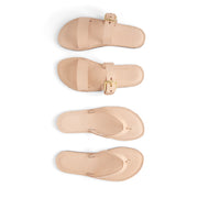 Set of beige sandals with a buckle on a white background made by using a pattern