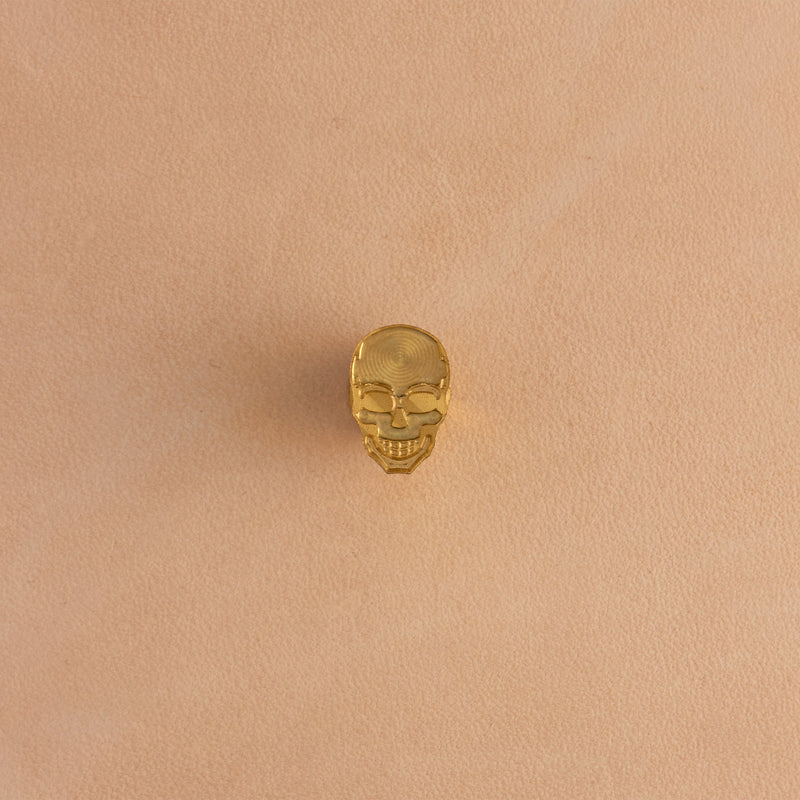 Sello de latón con calavera